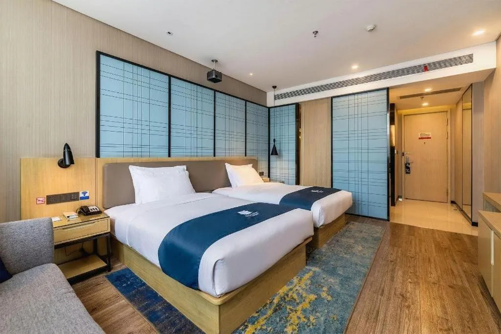 Bed in Echarm Hotel Kunming Railway Station Huancheng South Road Metro Station