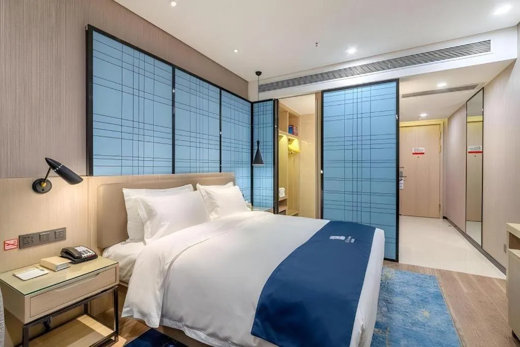 Bed in Echarm Hotel Kunming Railway Station Huancheng South Road Metro Station