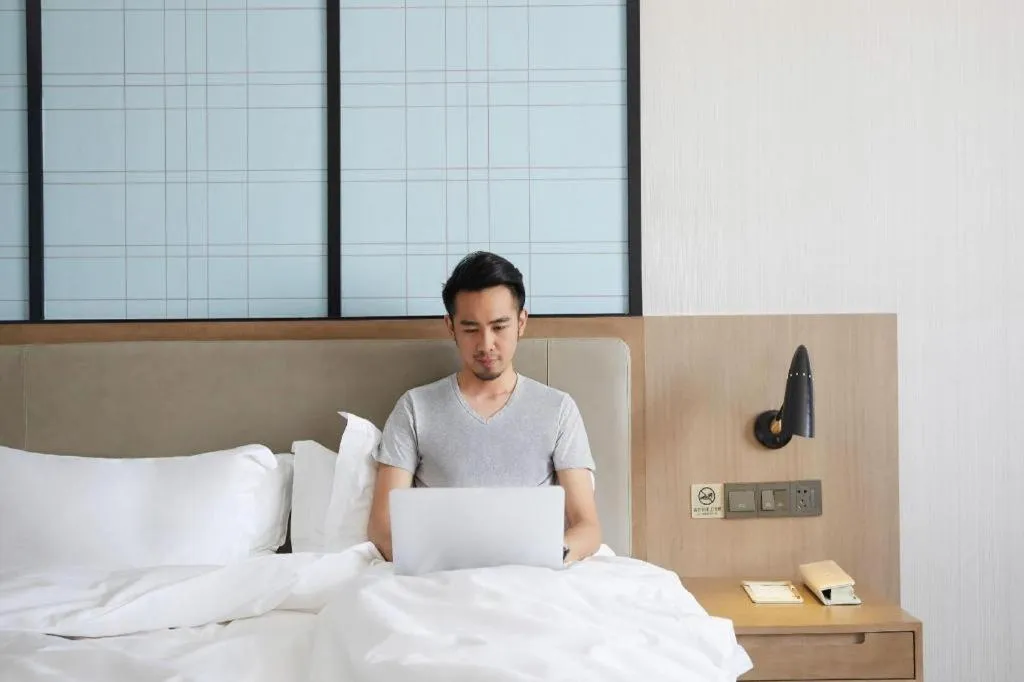 Bed in Echarm Hotel Kunming Railway Station Huancheng South Road Metro Station