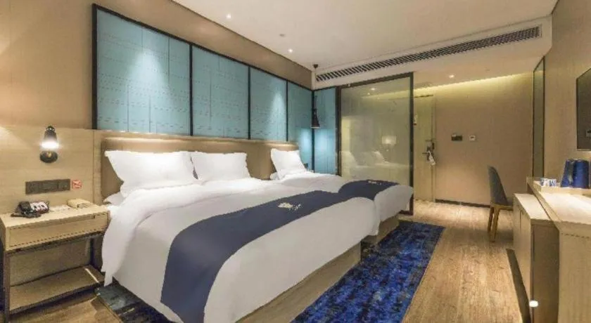 Bed in Echarm Hotel Kunming Railway Station Huancheng South Road Metro Station