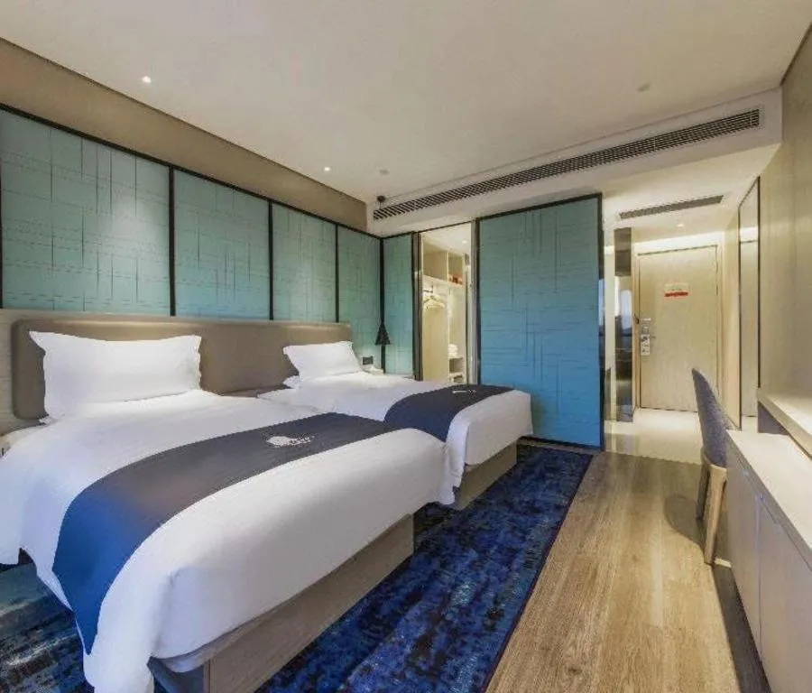 Bed in Echarm Hotel Kunming Railway Station Huancheng South Road Metro Station