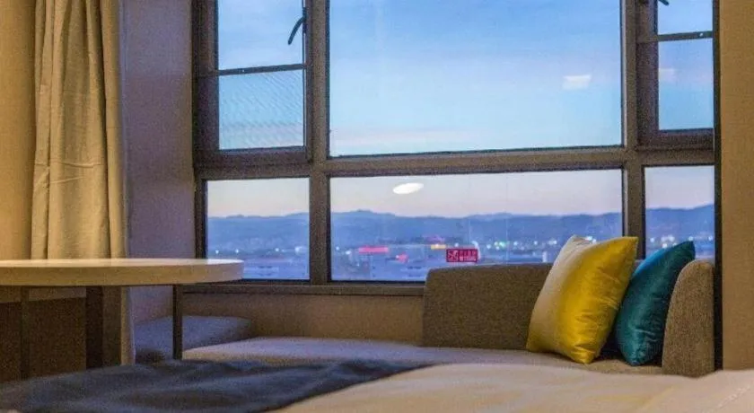 Bed in Echarm Hotel Kunming Railway Station Huancheng South Road Metro Station