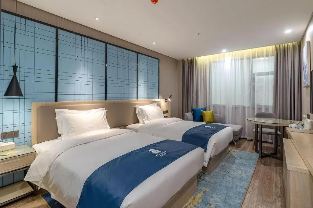 Bed in Echarm Hotel Kunming Railway Station Huancheng South Road Metro Station