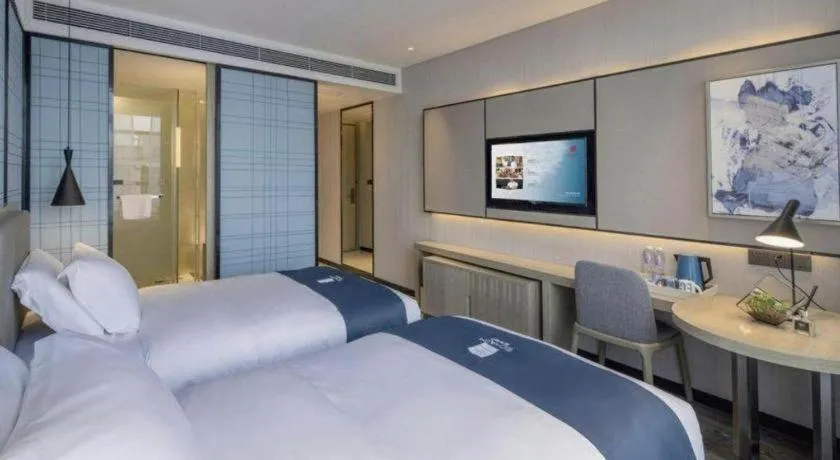 Bed in Echarm Hotel Kunming Railway Station Huancheng South Road Metro Station