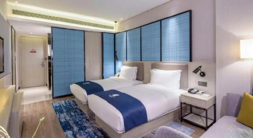 Bed in Echarm Hotel Kunming Railway Station Huancheng South Road Metro Station