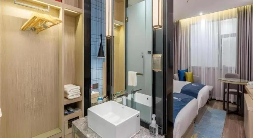 Bed in Echarm Hotel Kunming Railway Station Huancheng South Road Metro Station