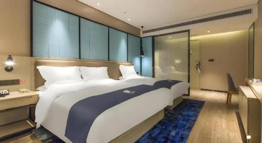 Bed in Echarm Hotel Kunming Railway Station Huancheng South Road Metro Station