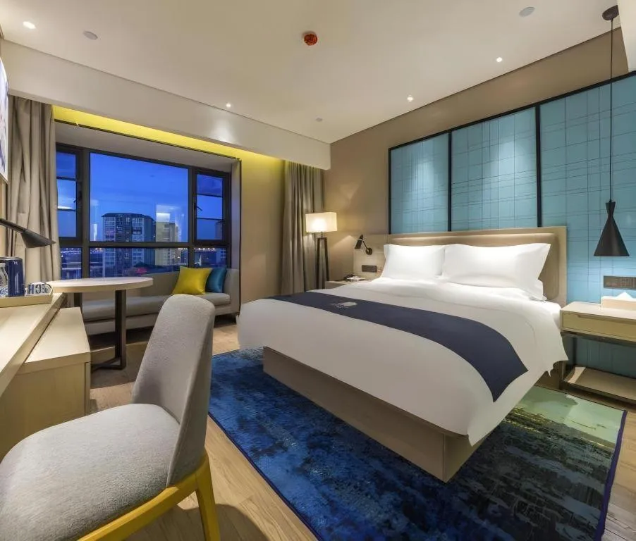 Bed in Echarm Hotel Kunming Railway Station Huancheng South Road Metro Station