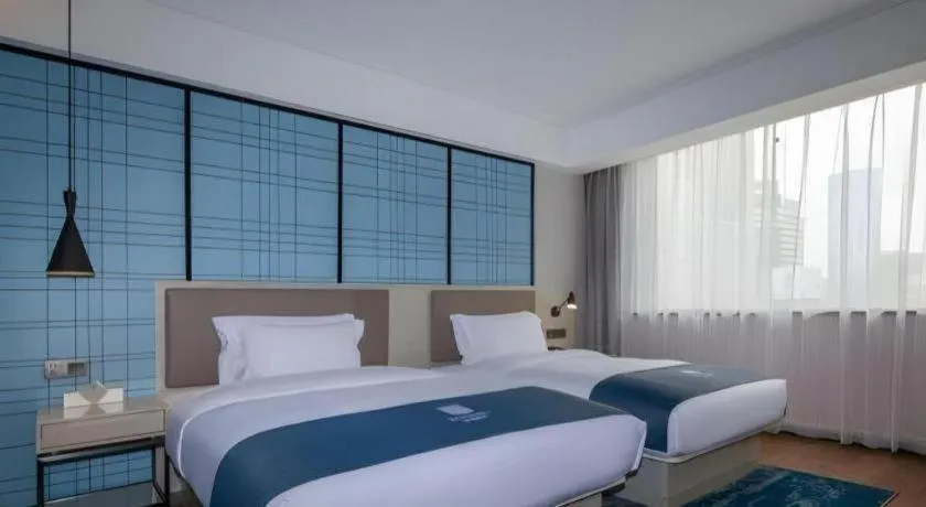 Bed in Echarm Hotel Kunming Railway Station Huancheng South Road Metro Station