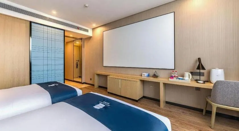Bed in Echarm Hotel Kunming Railway Station Huancheng South Road Metro Station