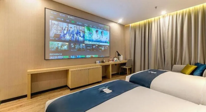 Bed in Echarm Hotel Kunming Railway Station Huancheng South Road Metro Station