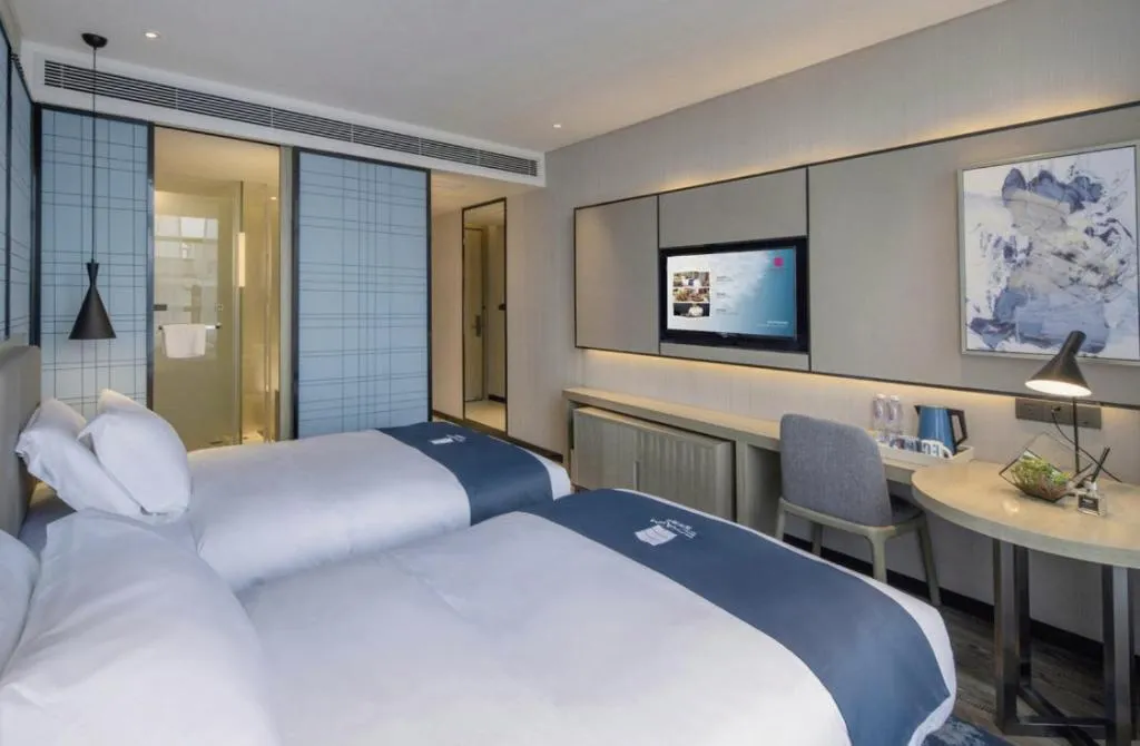 Bed in Echarm Hotel Kunming Railway Station Huancheng South Road Metro Station