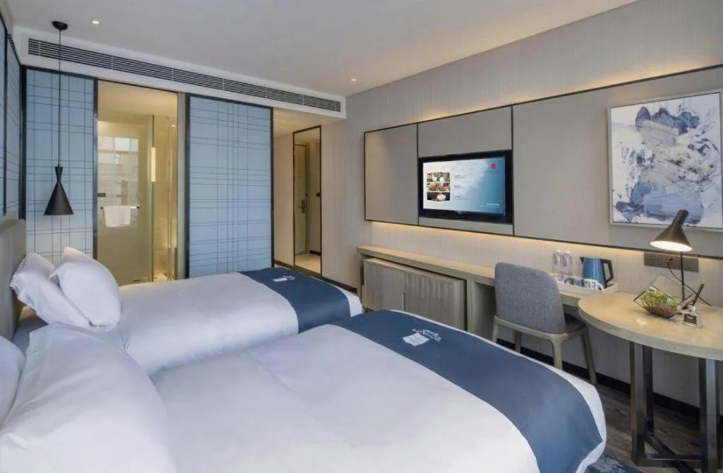 Bed in Echarm Hotel Kunming Railway Station Huancheng South Road Metro Station