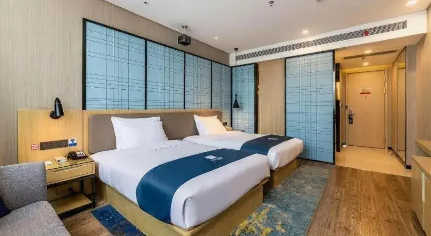 Bed in Echarm Hotel Kunming Railway Station Huancheng South Road Metro Station Bed in Echarm Hotel Kunming Railway Station Huancheng South Road Metro Station