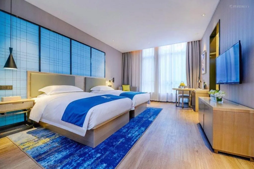 Bed in Echarm Hotel Kunming Railway Station Huancheng South Road Metro Station