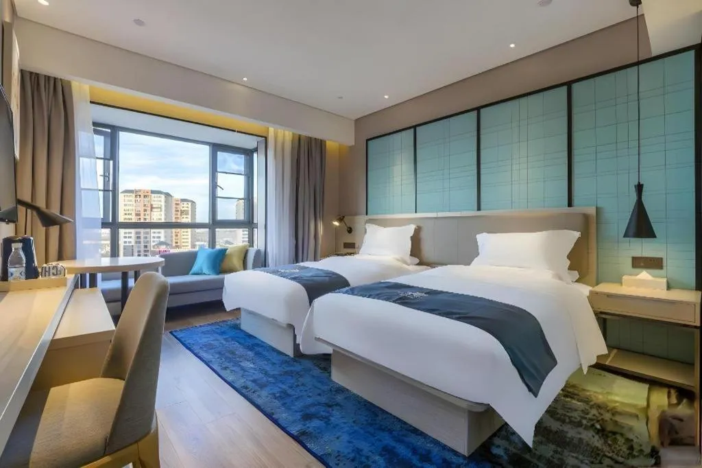 Bed in Echarm Hotel Kunming Railway Station Huancheng South Road Metro Station