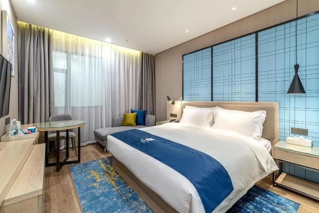 Bed in Echarm Hotel Kunming Railway Station Huancheng South Road Metro Station