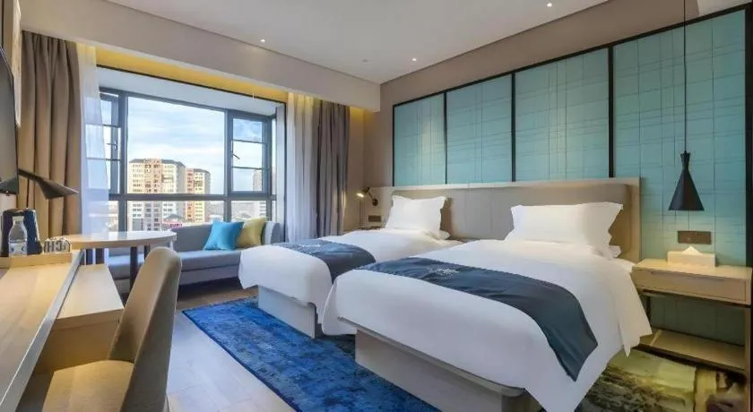 Bed in Echarm Hotel Kunming Railway Station Huancheng South Road Metro Station