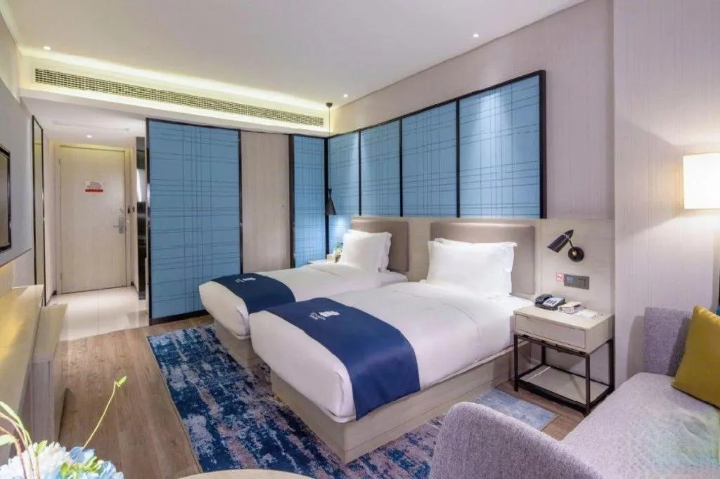 Bed in Echarm Hotel Kunming Railway Station Huancheng South Road Metro Station