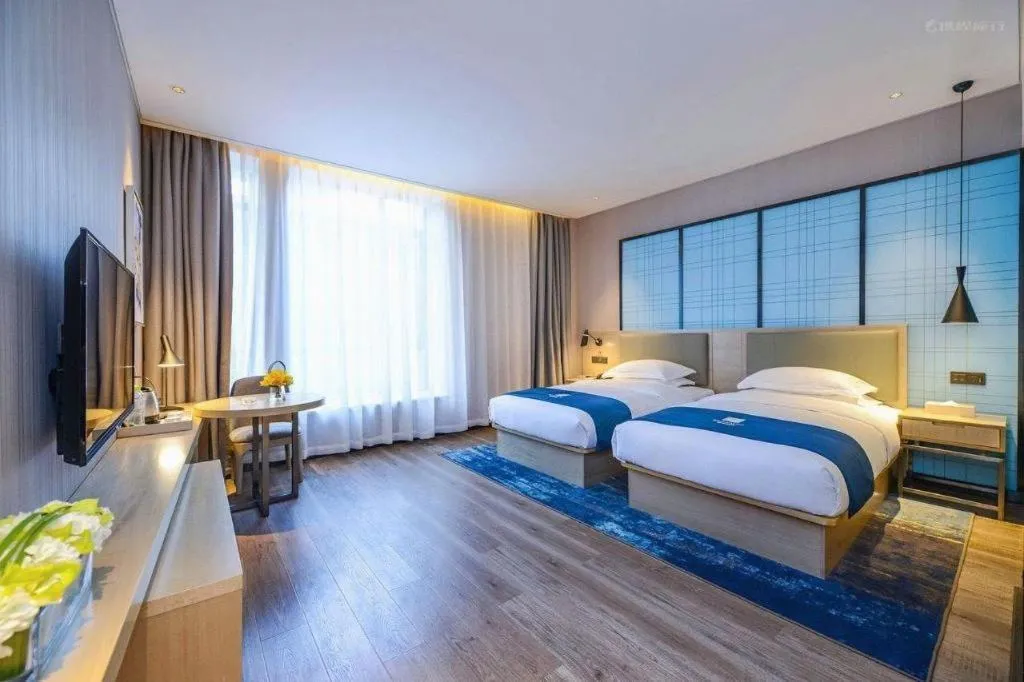 Bed in Echarm Hotel Kunming Railway Station Huancheng South Road Metro Station