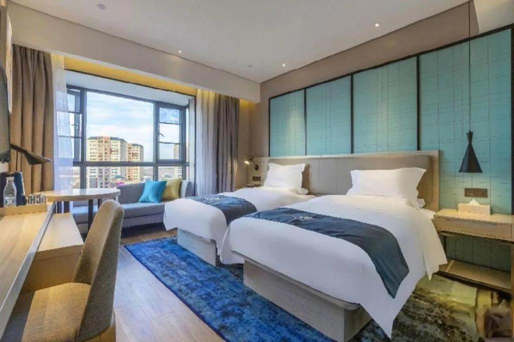 Bed in Echarm Hotel Kunming Railway Station Huancheng South Road Metro Station