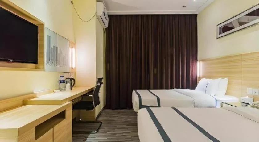 Bed in City Comfort Inn Guangzhou Tianhetang Xiajunjing Garden