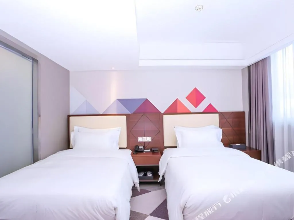 Bed in Borrman Hotel Guangzhou Railway Station Sanyuanli Metro Station