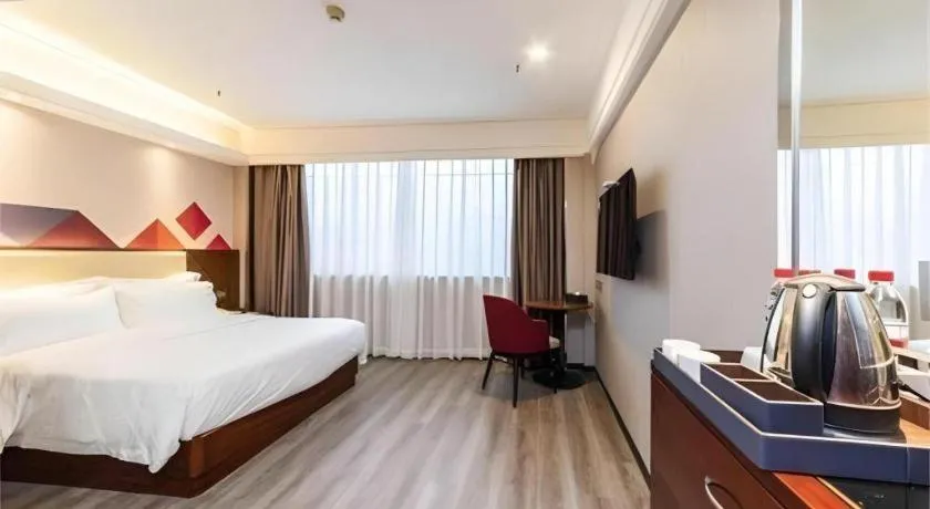 Bed in Borrman Hotel Guangzhou Railway Station Sanyuanli Metro Station