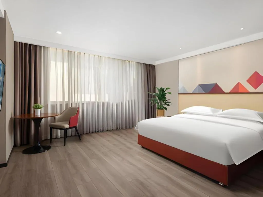 Bed in Borrman Hotel Guangzhou Railway Station Sanyuanli Metro Station