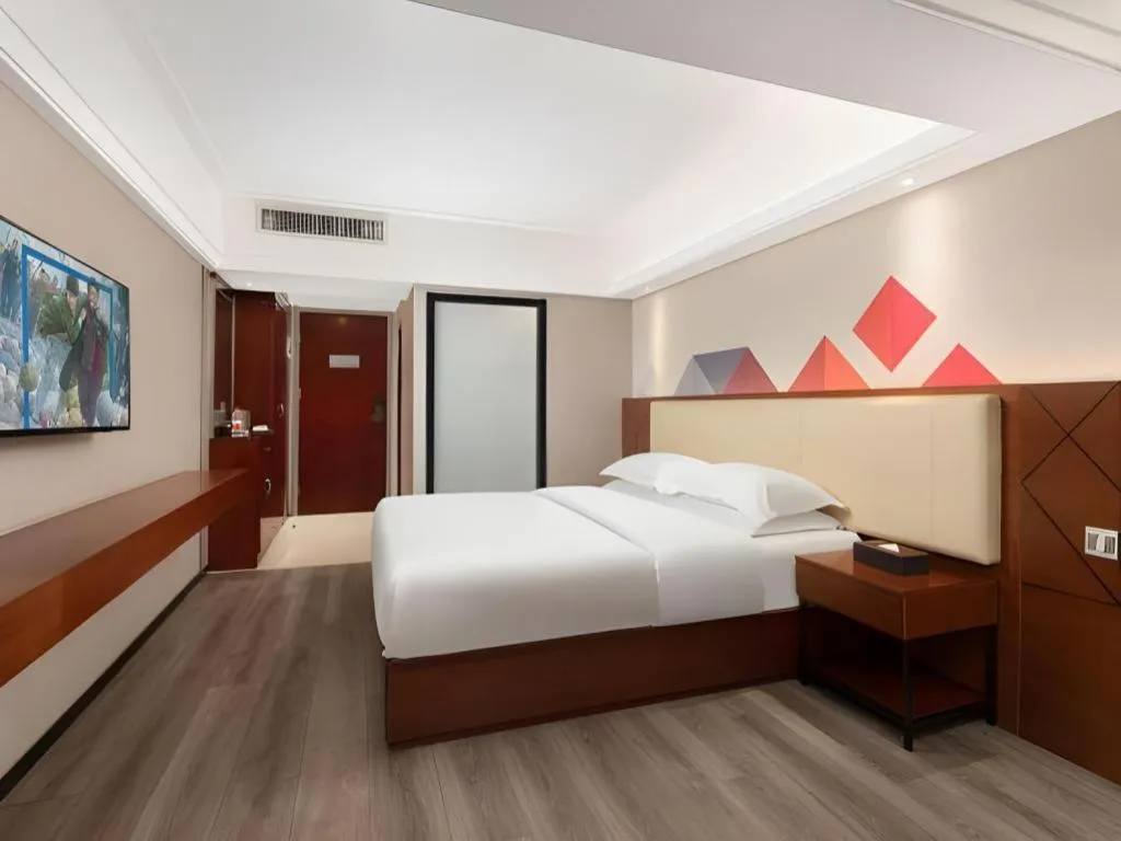 Bed in Borrman Hotel Guangzhou Railway Station Sanyuanli Metro Station