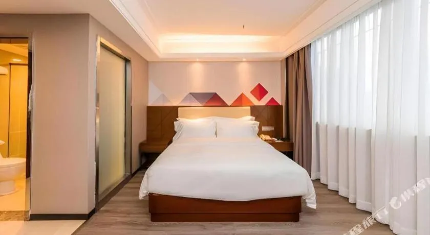 Bed in Borrman Hotel Guangzhou Railway Station Sanyuanli Metro Station