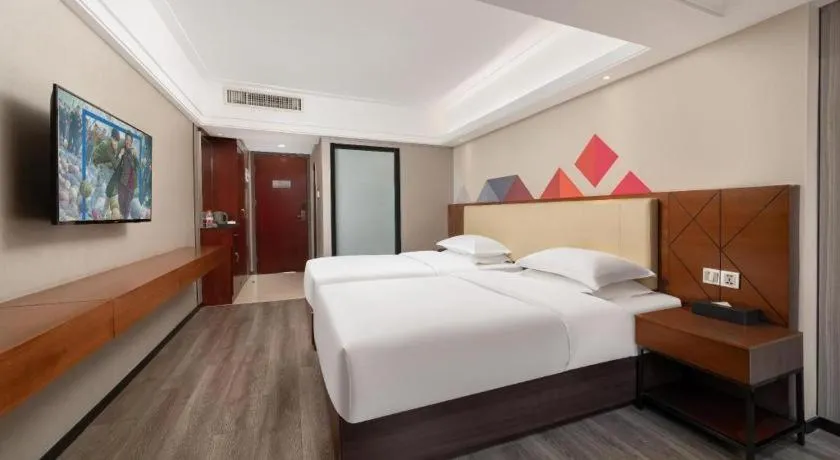 Bed in Borrman Hotel Guangzhou Railway Station Sanyuanli Metro Station