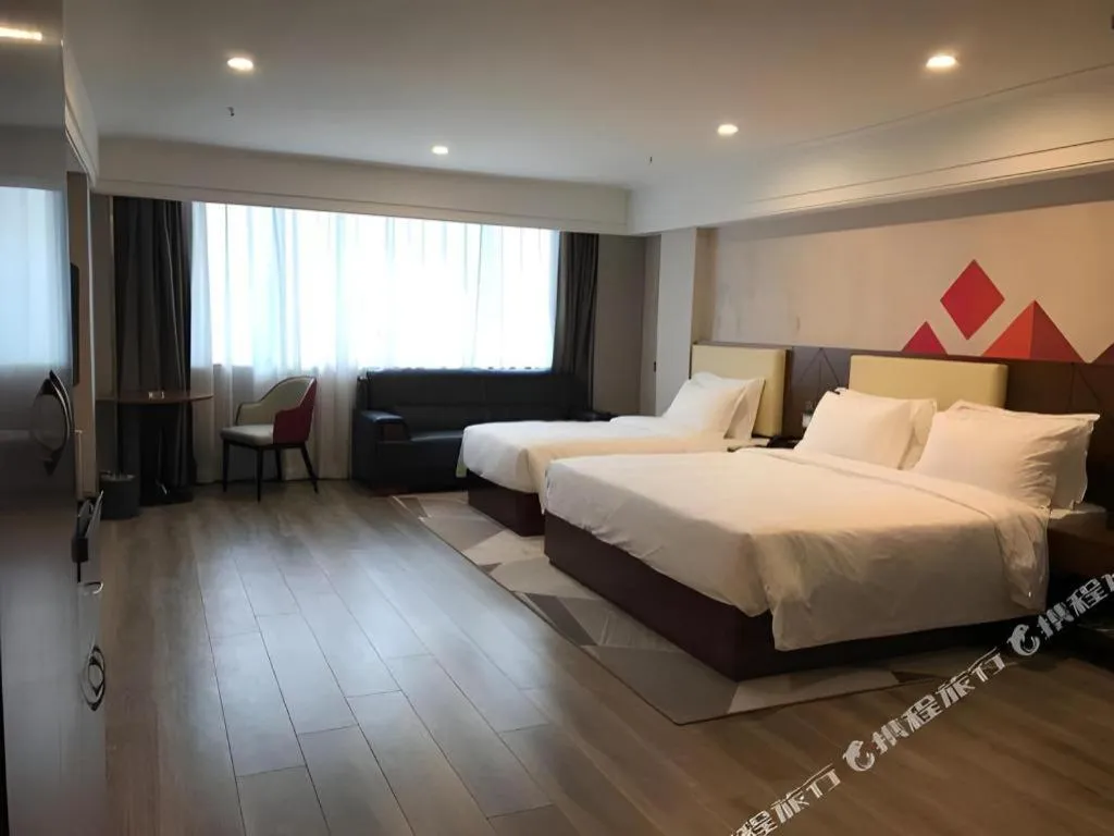 Bed in Borrman Hotel Guangzhou Railway Station Sanyuanli Metro Station