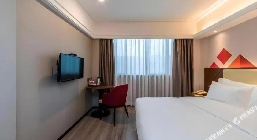 Bed in Borrman Hotel Guangzhou Railway Station Sanyuanli Metro Station