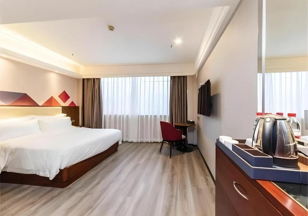 Bed in Borrman Hotel Guangzhou Railway Station Sanyuanli Metro Station