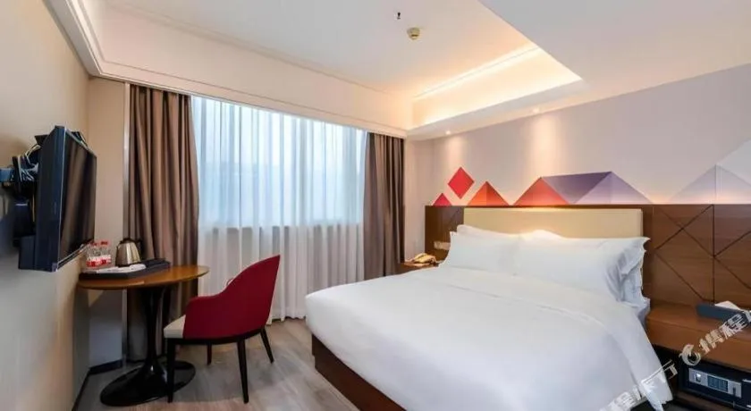 Bed in Borrman Hotel Guangzhou Railway Station Sanyuanli Metro Station