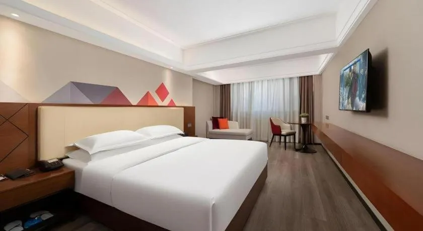 Bed in Borrman Hotel Guangzhou Railway Station Sanyuanli Metro Station