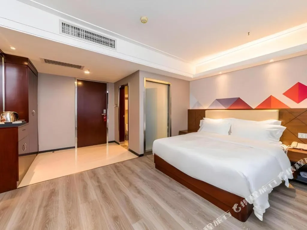 Bed in Borrman Hotel Guangzhou Railway Station Sanyuanli Metro Station