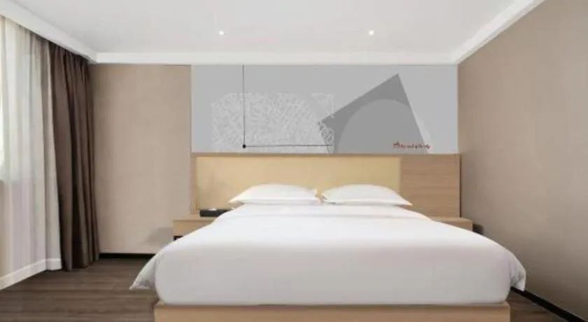 Bed in Borrman Hotel Guangzhou Railway Station Sanyuanli Metro Station