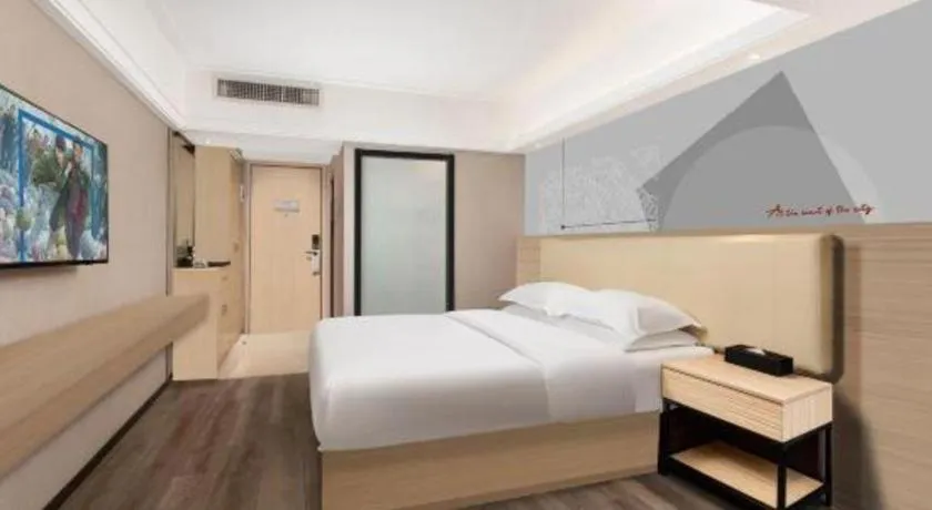 Bed in Borrman Hotel Guangzhou Railway Station Sanyuanli Metro Station