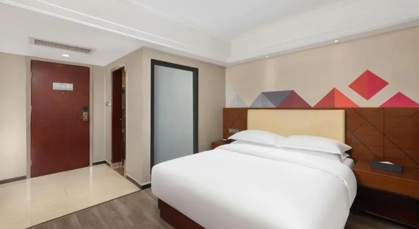 Bed in Borrman Hotel Guangzhou Railway Station Sanyuanli Metro Station