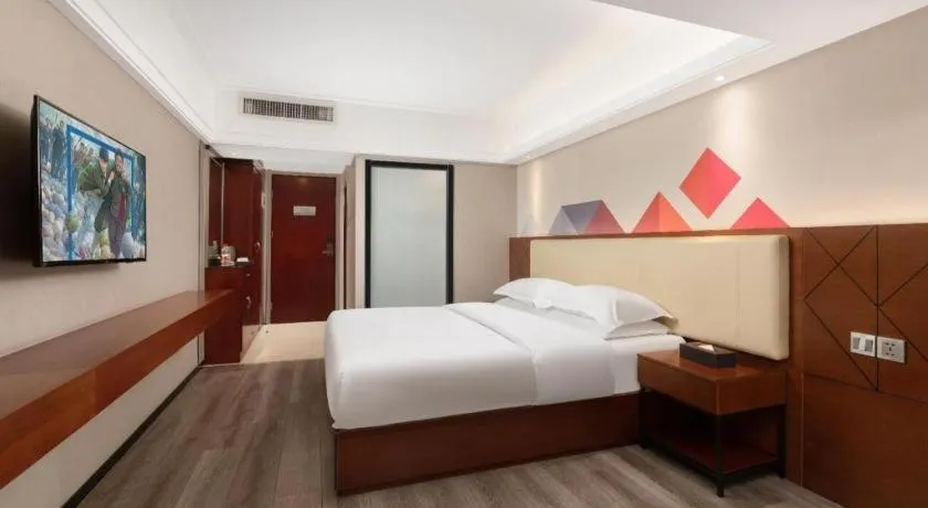 Bed in Borrman Hotel Guangzhou Railway Station Sanyuanli Metro Station