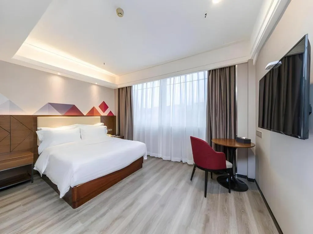 Bed in Borrman Hotel Guangzhou Railway Station Sanyuanli Metro Station