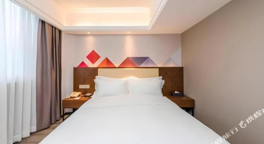 Bed in Borrman Hotel Guangzhou Railway Station Sanyuanli Metro Station