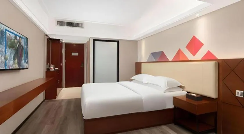 Bed in Borrman Hotel Guangzhou Railway Station Sanyuanli Metro Station