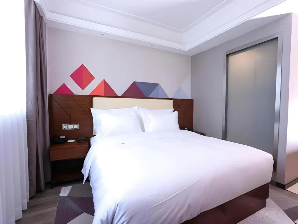 Bed in Borrman Hotel Guangzhou Railway Station Sanyuanli Metro Station