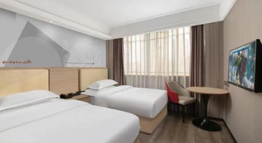 Bed in Borrman Hotel Guangzhou Railway Station Sanyuanli Metro Station