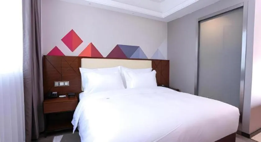 Bed in Borrman Hotel Guangzhou Railway Station Sanyuanli Metro Station