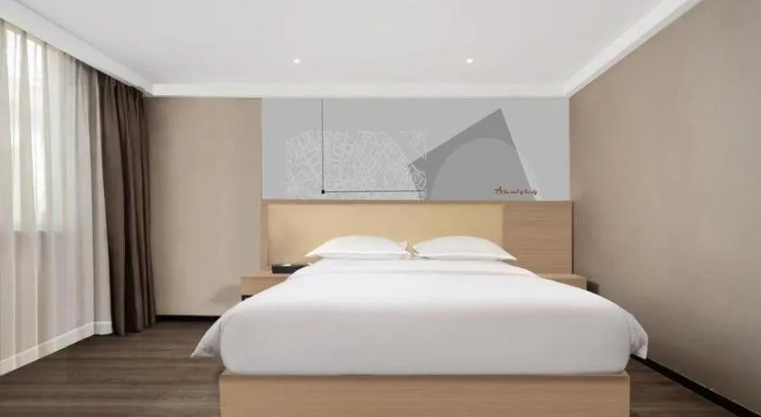 Bed in Borrman Hotel Guangzhou Railway Station Sanyuanli Metro Station