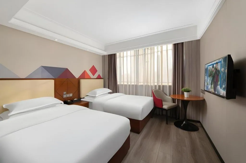 Bed in Borrman Hotel Guangzhou Railway Station Sanyuanli Metro Station